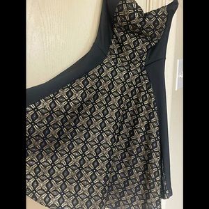 A beautiful gold and black party dress, small size. Used but in good condition